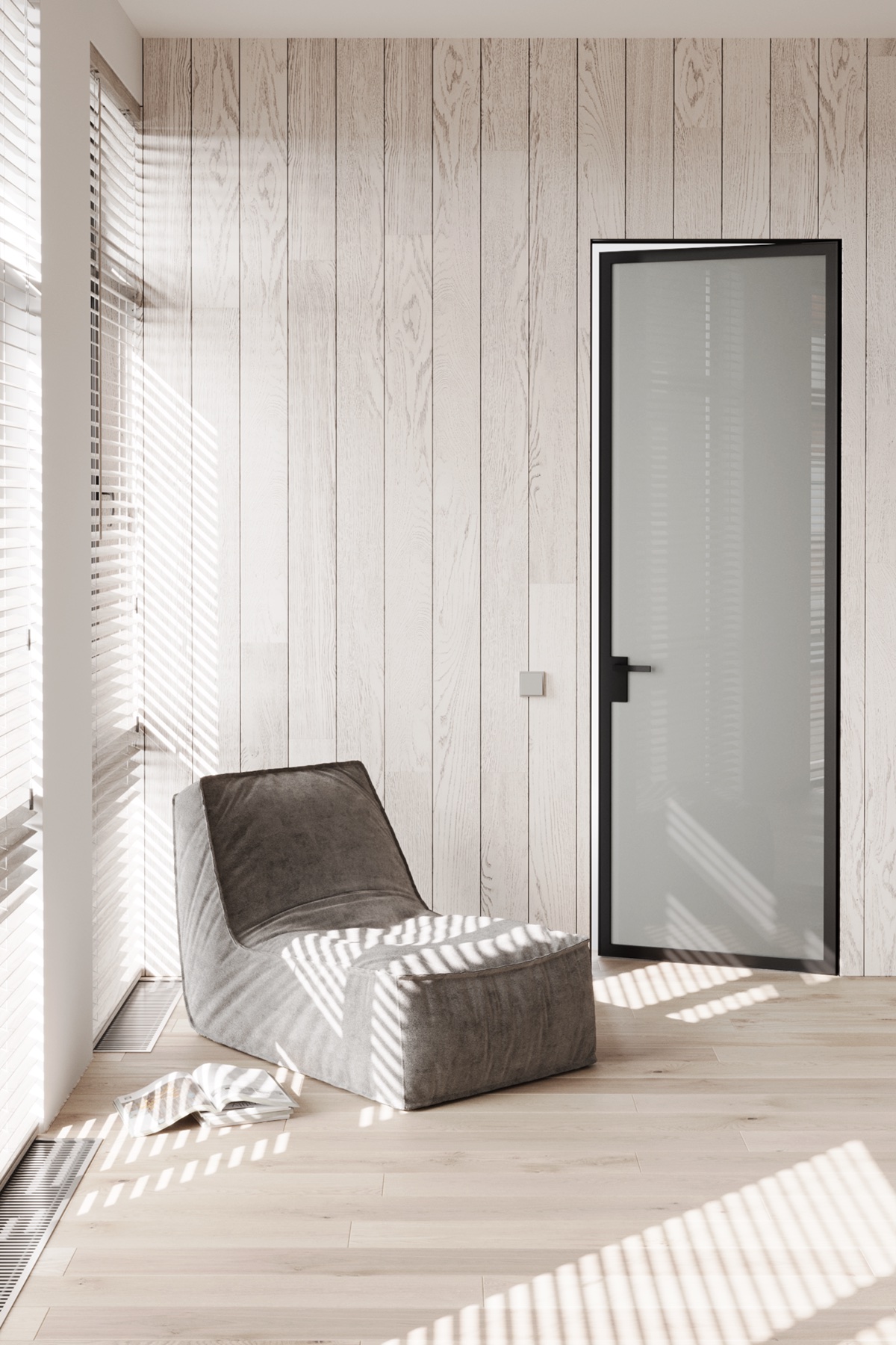 Soft armchair and magazines beside a glazed door